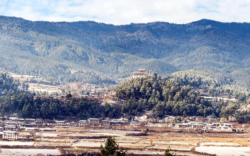 Some snow over the city of Bumthang in Bhutan