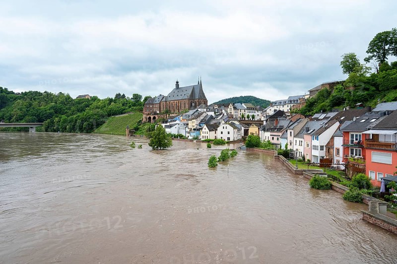 Flood of the river Saar, Saarburg in Saarland, Germany, flooded trees and paths, high water level, climate change, Europe