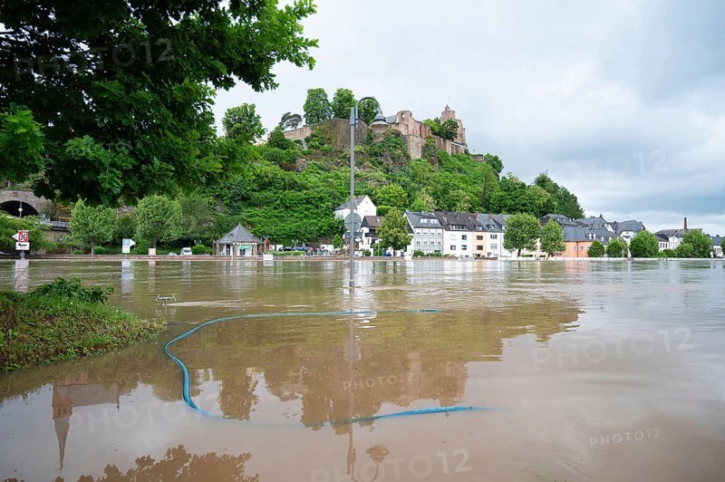 Flood of the river Saar, Saarburg in Saarland, Germany, flooded trees and paths, high water level, climate change, Europe