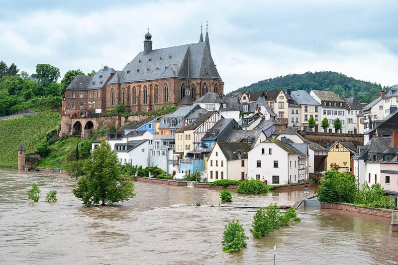 Flood of the river Saar, Saarburg in Saarland, Germany, flooded trees and paths, high water level, climate change, Europe