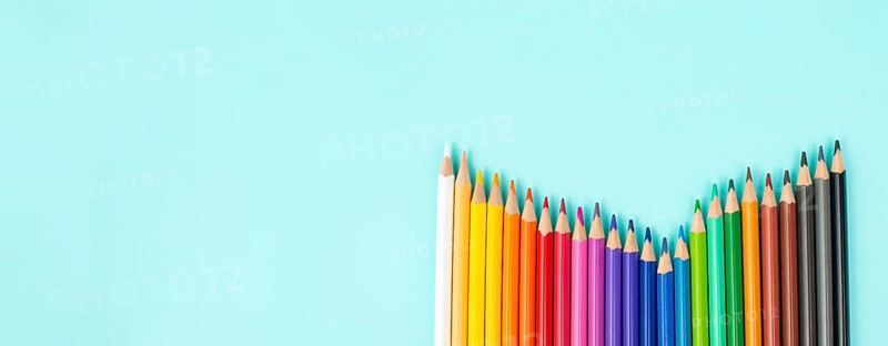 Color pencils collection in a row, back to school, drawing supplies, blue background with copy space