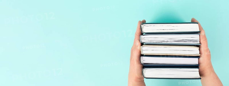 Hands holding pile of books, reading and learning new skill, knowledge is power, education concept, university student, back to school