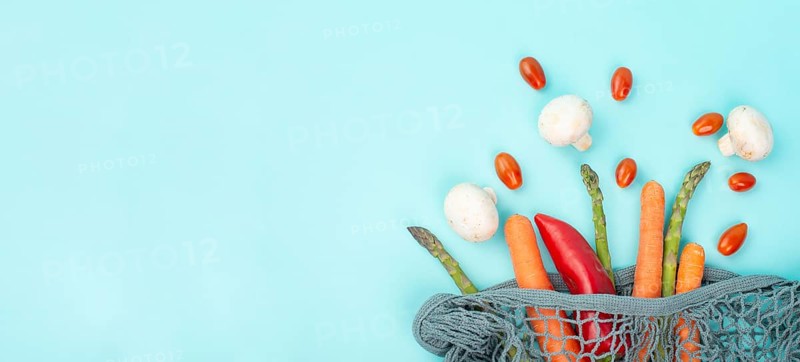 Asparagus sprout, mushrooms, carrots and tomatoes, zero waste, mesh bag with vegetables, shopping grocery, healthy food ingredients