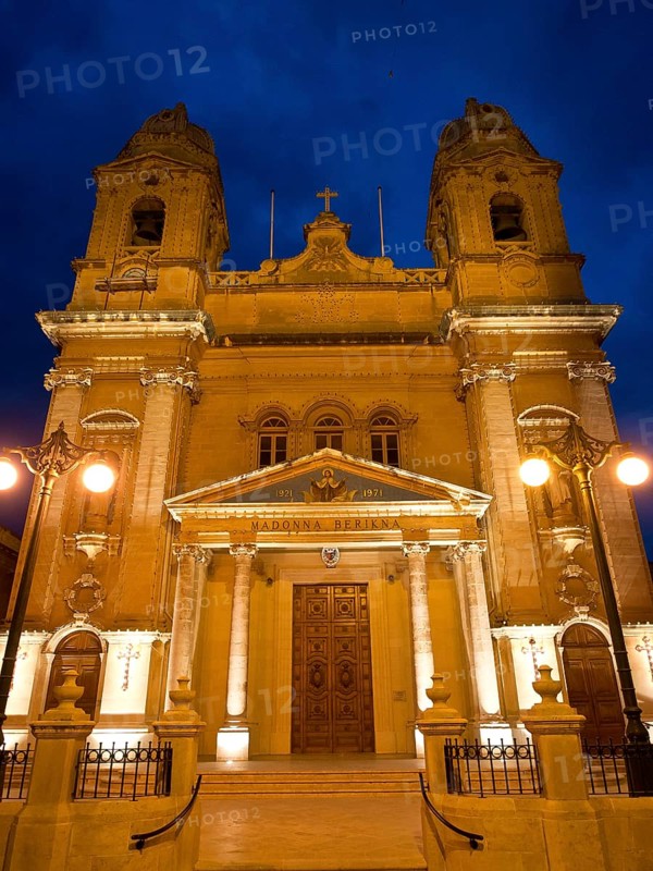Historic church, warmly lit at night, marsaxlokk, mediterranean sea, malta