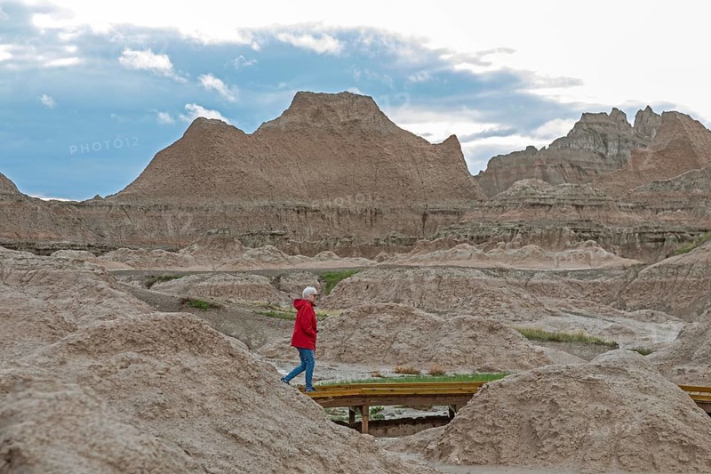 Badlands National Park, South Dakota. Susan Newell, 75, hikes on a boardwalk