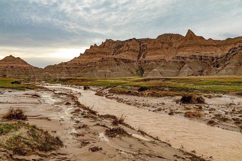 Badlands National Park, South Dakota, A stream runs through the normally dry landscape after a heavy rainstorm