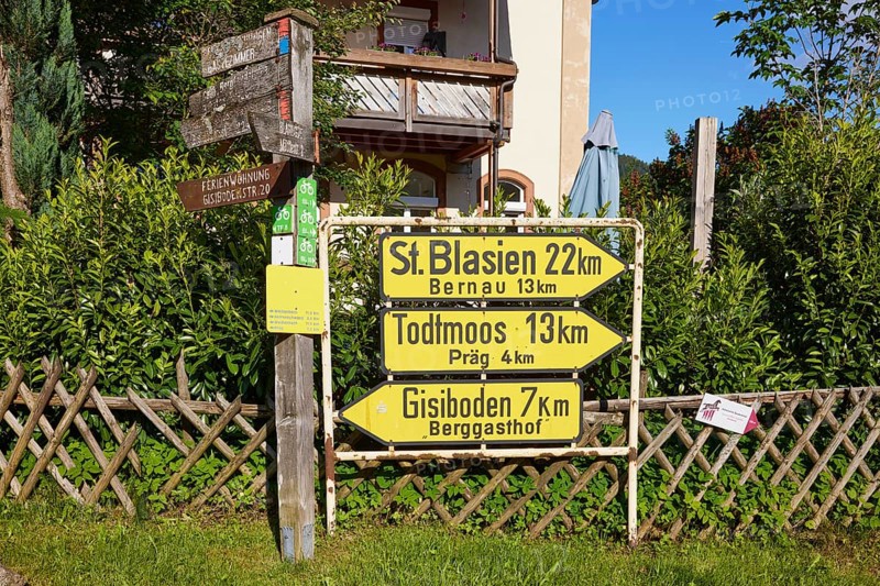 Old yellow signposts to St. Blasien, Bernau, Todtmoos, Präg and Gisiboden in the historic district of Geschwend, Todtnau, Black Forest, district of Lorrach, Baden-Württemberg, Germany, Europe