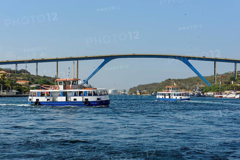 View of high road bridge Queen Juliana Bridge Queen Juliana Bridge over St. Anna Bay Sint Annabaai in Willemstad, in front of it two ferries over inlet of Caribbean Sea, Caribbean, Windward Islands, Netherlands Antilles, ABC Islands ABC Islands, Willemstad, Curaçao Curacao