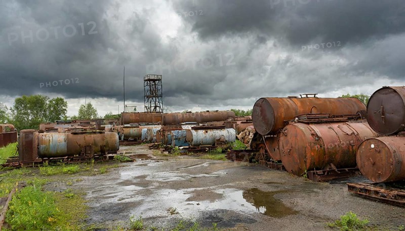 Rusty tanks and pipes in an abandoned junkyard under a cloudy sky, symbol photo, AI generated, AI generated