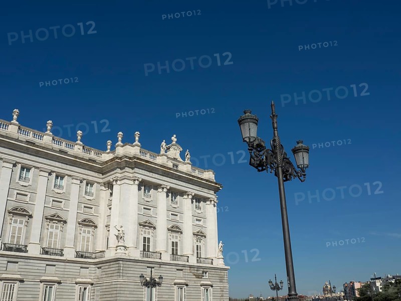 Magnificent wing and wrought-iron lanterns under a bright blue sky, Madrid, Spain, Europe