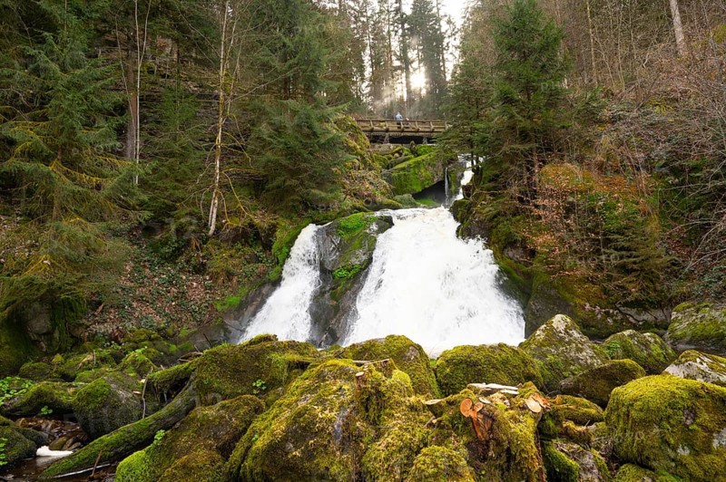 Triberg waterfall in the Black Forest, highest fall in Germany, Gutach river plunges over seven major steps into the valley, wooden bridge