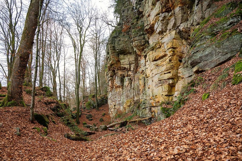 Devil Gorge at the Eifel, Teufelsschlucht with mighty boulders and canyon, hiking trail in Germany, sandstone rock formation, autumn