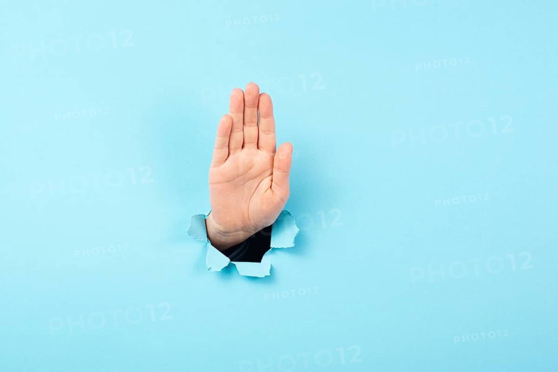 Hand waving, saying hello, friendly gesture, high five or stop sign, communication, torn paper hole