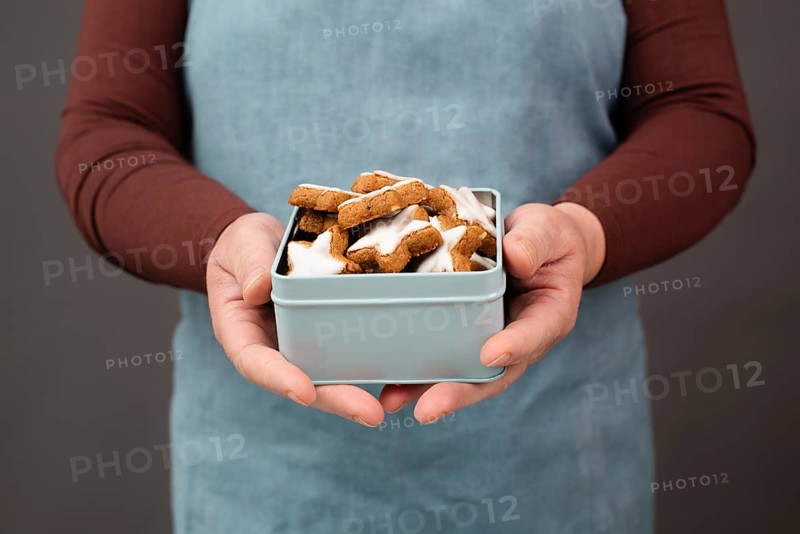 Cinnamon stars, Zimtsterne traditional german christmas cookies in a box, gingerbread with anise spice for holidays