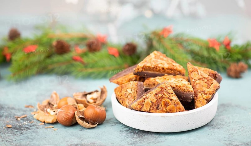 Nut corner triangles, traditional german sweets called Nussecke, covered with chocolate, christmas cake
