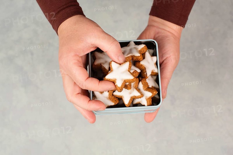 Cinnamon stars, Zimtsterne traditional german christmas cookies in a box, gingerbread with anise spice for holidays
