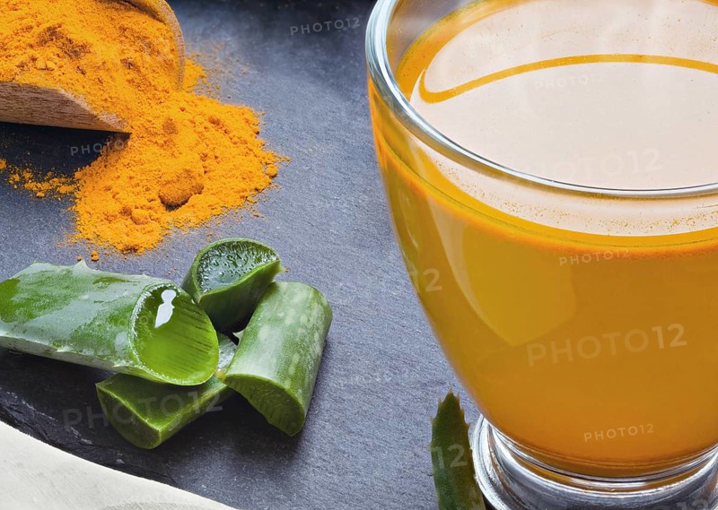 Drink aloe vera and turmeric. Glass cups on a slate tray