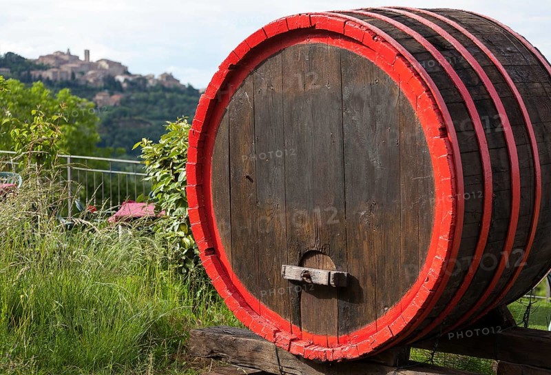 Wine barrels and the hilltop town of Montepulciano, Tuscany, Italy, Europe