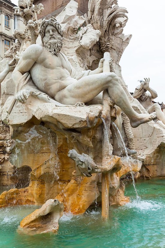 Statue of the god Zeus in Bernini's Fountain of the Four Rivers in Piazza Navona, Rome. Detail of the allegorical Ganges figure