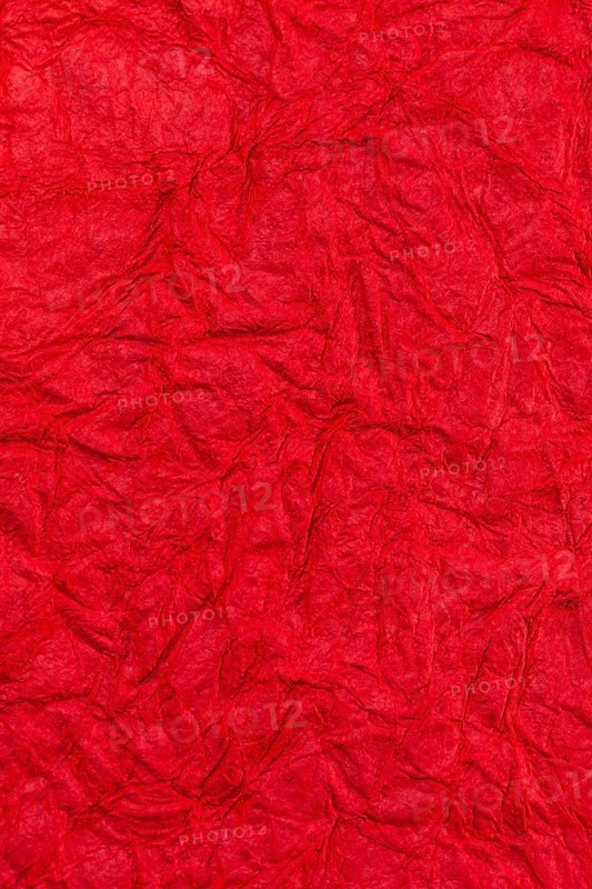 Background surface of wrinkled red and crumpled paper
