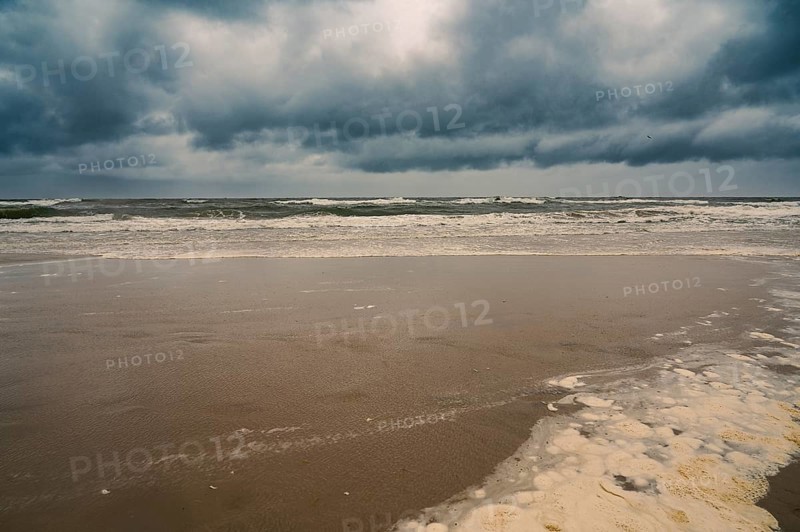 Baltic sea beach landscape, coast at the island of Usedom in Germany, storm and rain over the brackish water, high waves