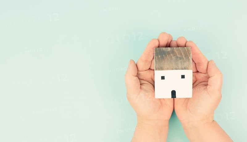 Hands holding house, buying or renting a home, real estate concept, investment in property, sustainable lifestyle, business and insurance