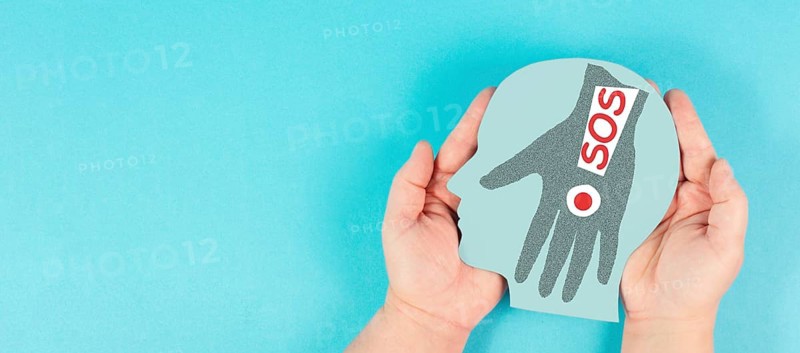 Domestic violence, hand hits face, sos on exclamation mark, international awareness month october for victims and survivors