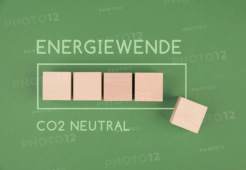 Energy transition, CO2 neutral stands in german language besides loading bar, reduce carbon emission footprint, sustainable renewable electricity, environment protection, eco lifestyle