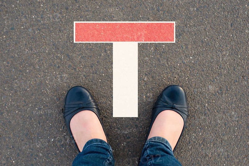 Standing in front of a dead end sign, burn out and depression, personal crisis, impasse of thoughts