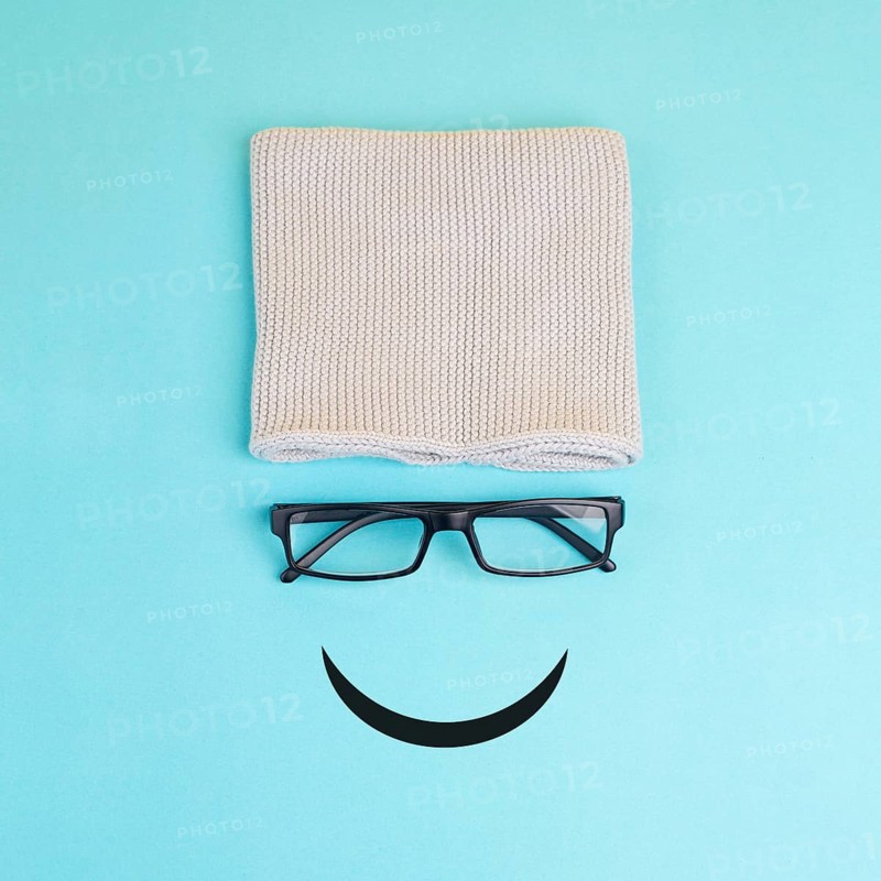 Happy smiling face with eyeglasses and hat, mental health concept, positive mindset, support and evaluation symbol