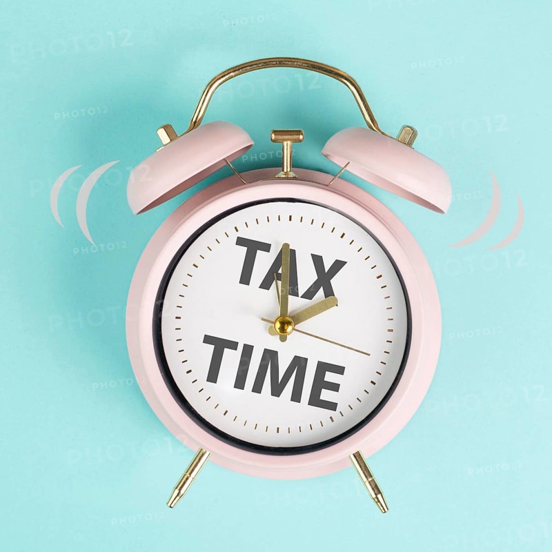 Tax time, alarm clock for taxation, deadline for payment, financial income