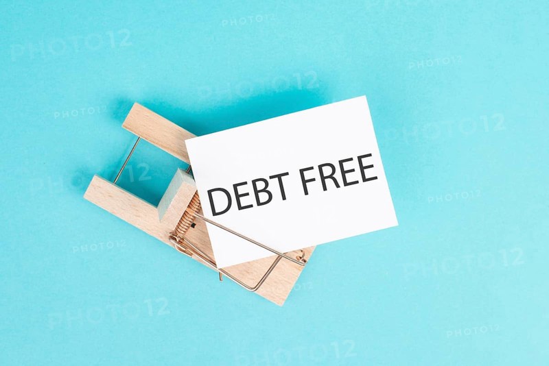 Debt free is standing on a paper, ending credit payments and bank loans, financial freedom, trapped in money problems