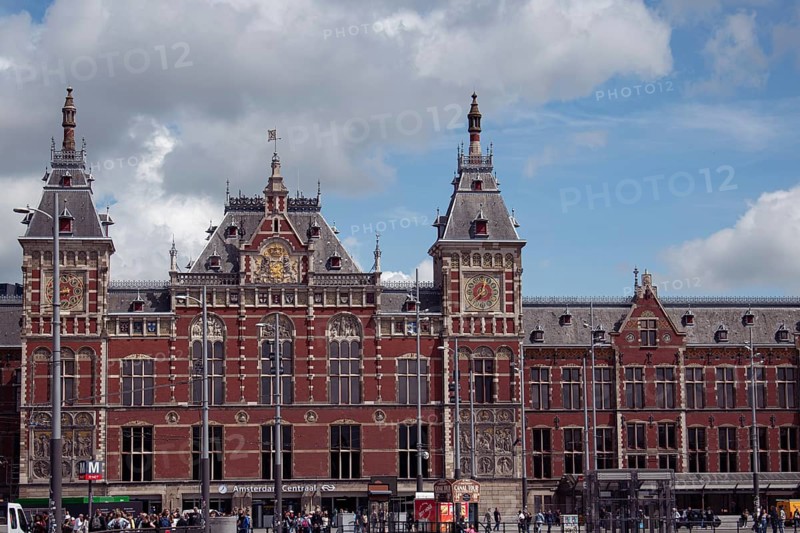 Historic Amsterdam Central Station with towers and colourful bricks, Amsterdam, Netherlands