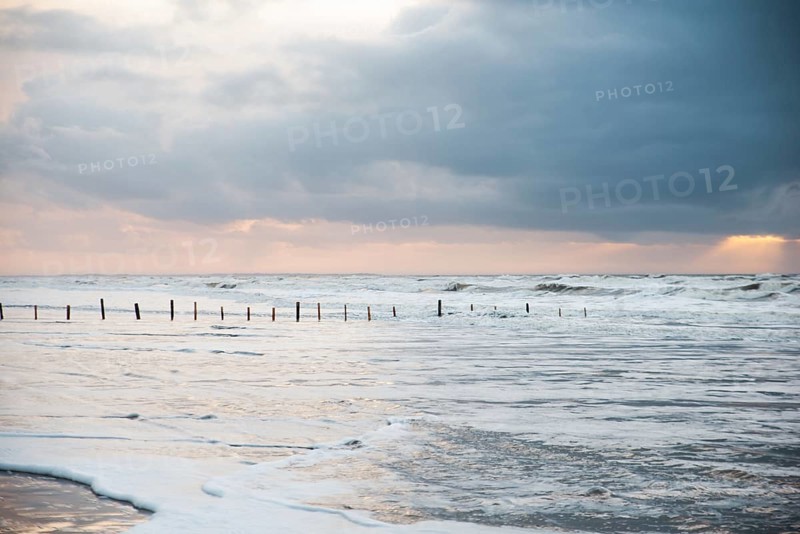 Wadden sea at low tide, North sea beach landscape, coast on Romo island in Denmark at sunset, vacation und lifestyle
