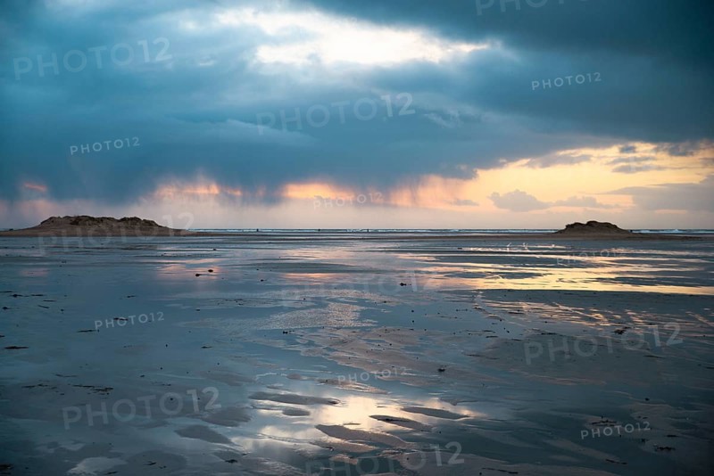 Wadden sea at low tide, North sea beach landscape, coast on Romo island in Denmark at sunset, vacation und lifestyle