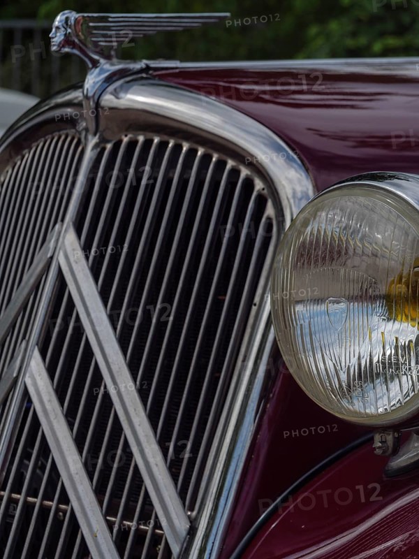 Front view of a red vintage car with striking radiator grille and detailed emblem, winterswijk, gelderland, the netherlands