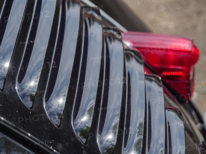 Close-up of a black vintage car, showing air vents and reflective surfaces, winterswijk, gelderland, the netherlands
