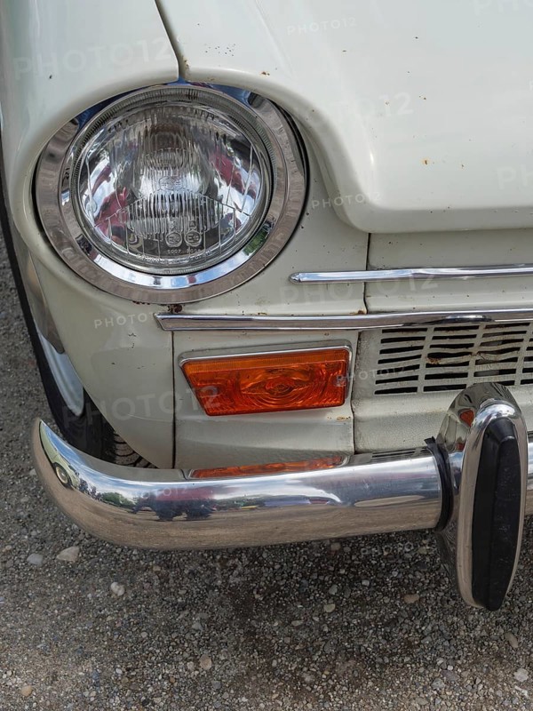 Close-up of a vintage car, showing the front headlight and part of the bumper, winterswijk, gelderland, the netherlands