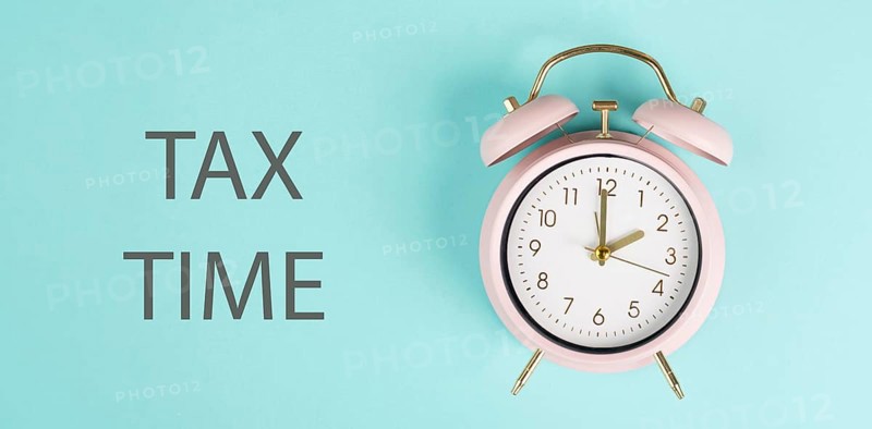Tax time, alarm clock for taxation, deadline for payment, financial income