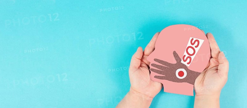 Domestic violence, hand hits face, sos on exclamation mark, international awareness month october for victims and survivors