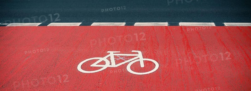 Road with a bicycle path in the city, eco friendly lifestyle, reduce co2 emission footprint