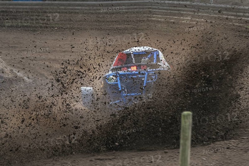 Grambek, Germany, September 10, 2022: Car racing Autocross ADAC NAX-Club Moelln, special buggy from behind on the race track spreading a lot of dirt and soil drift, copy space, selected focus, motion blur, Europe