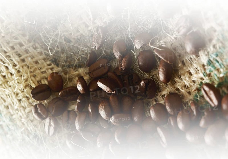 Coffee beans on coffee sack, close-up