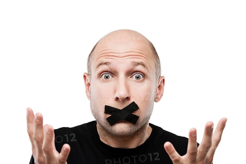 Forbidden word or speech censorship concept, scared adult man adhesive tape closed mouth white isolated