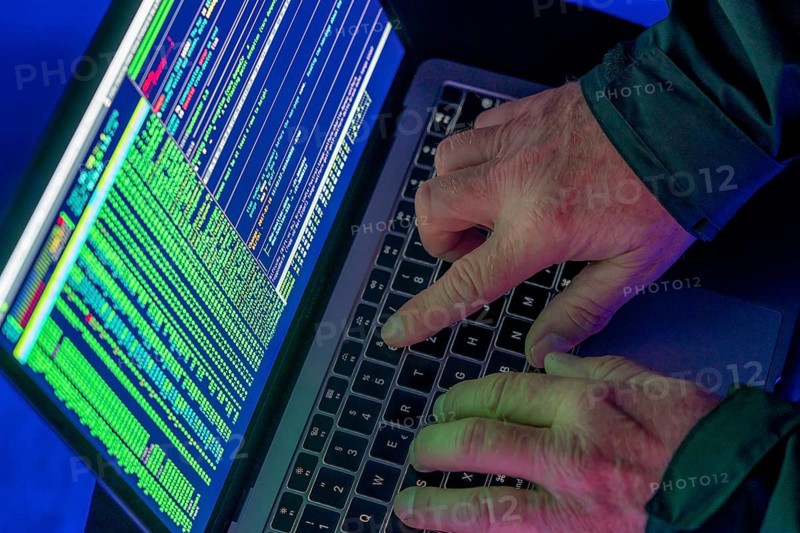 Symbolic image cyber attack, computer crime, cybercrime, computer hackers attack a network, computer, IT infrastructure