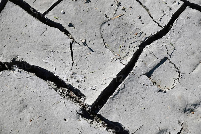 Farmer's bootprint in dried and cracked mudpan