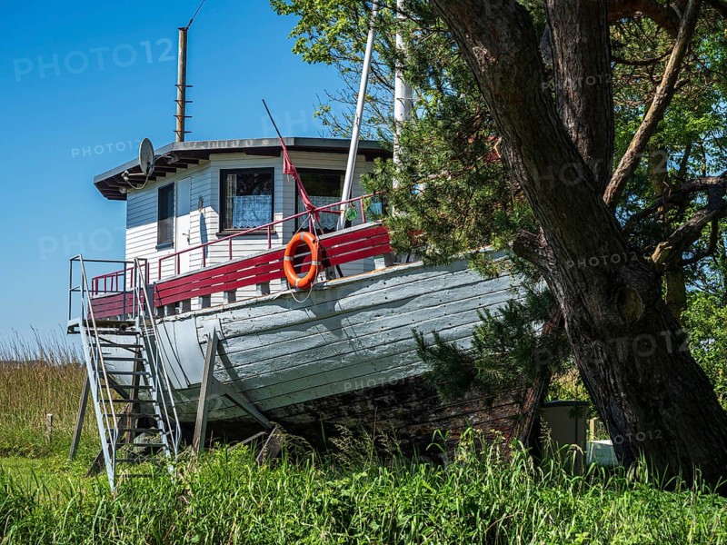 Fishing boat ashore as holiday home, Achterwasser near Ãœckeritz, Usedom island, Mecklenburg, Germany, Europe