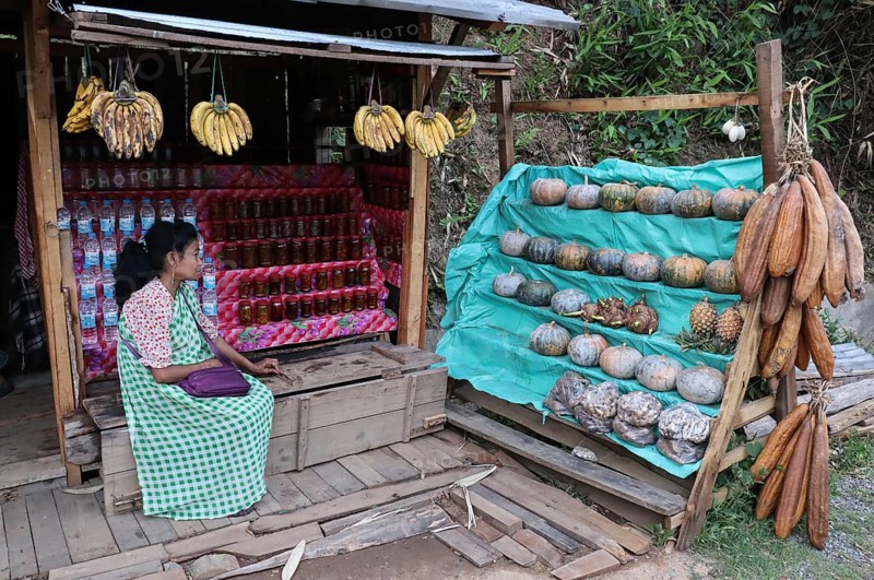 A khasi woman vendor selling home grown vegetables in her roadside stall, in Nongpoh, Meghalaya, India on 20 April 2021