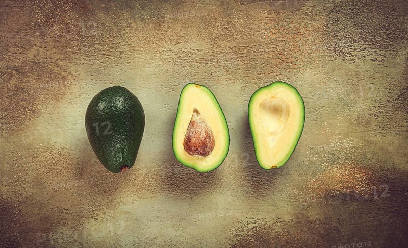 Fresh sliced avocado on the table, top view, food background, concept, menu, food styling