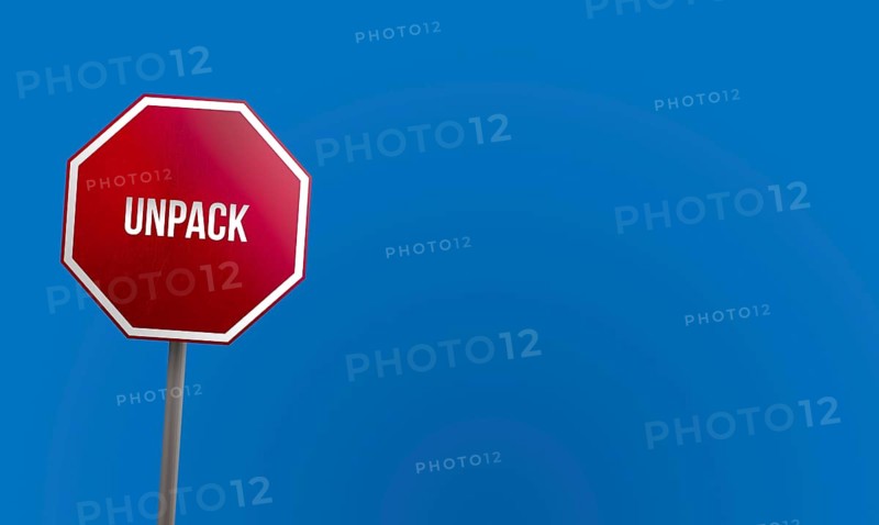 Unpack, red sign with blue sky